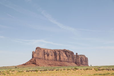 Rock formations on landscape against sky