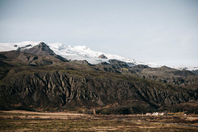 Scenic view of snowcapped mountains against sky