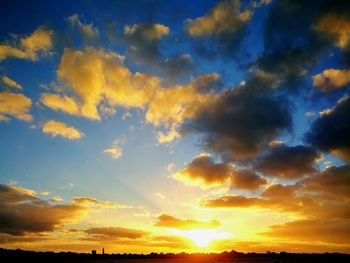 Silhouette landscape against scenic sky