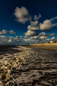 Scenic view of beach against sky