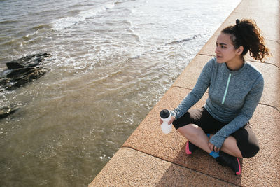 Girl drinking water after workout