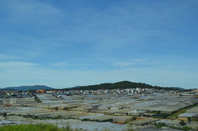 Scenic view of beach against blue sky