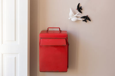 Close-up of red door on table at home