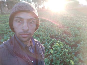 Portrait of young man against plants