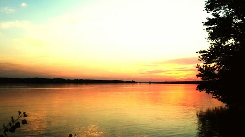 Scenic view of lake against sky during sunset