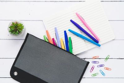 High angle view of multi colored pencils on table