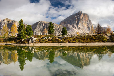 Scenic view of lake and mountains against sky