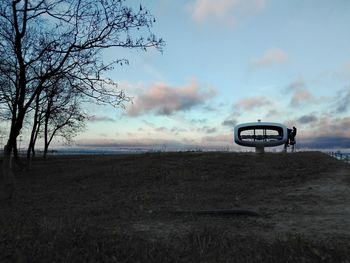 Scenic view of field against sky during sunset