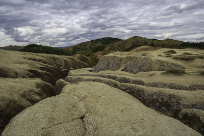 Scenic view of landscape against cloudy sky