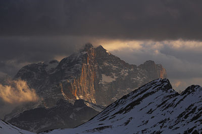 Civetta mount. italian dotolomites. scenic view of snowcapped mountains against sky during sunset