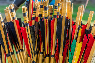 Close-up of multi colored traditional archery arrows