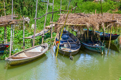 Boats moored in lake