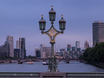 View of buildings in city at dusk