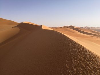 Scenic view of desert against clear sky