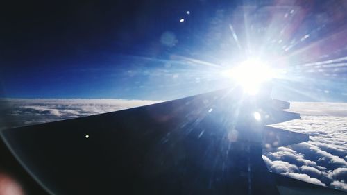 Airplane wing against sky