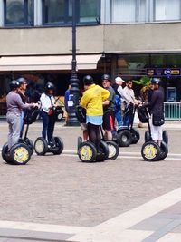 People riding bicycles on street