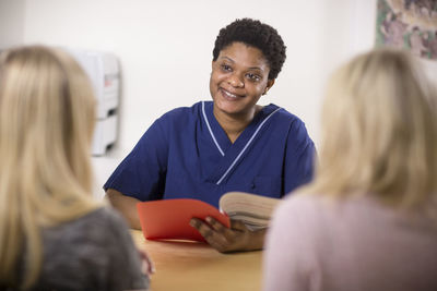 Doctor talking with patients