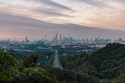 Cityscape against sky during sunset