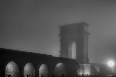 Low angle view of historic building against sky at night