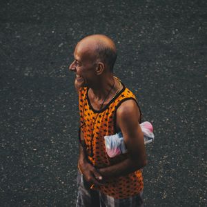 High angle view of man looking away on street