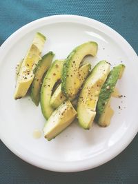 High angle view of avocados in plate