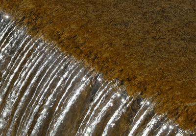 Transition in textures - from still water to waterfall