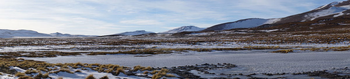 Scenic view of lake against sky during winter