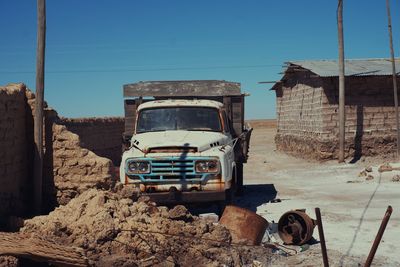 Abandoned vehicle against sky