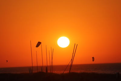 Scenic view of sea against orange sky during sunset