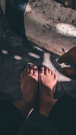 Low section of people standing on floor