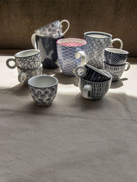 High angle view of coffee cups on table