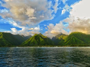 Scenic view of lake and mountains against sky