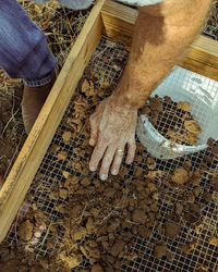 High angle view of man working on cutting board