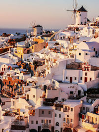 High angle view of townscape by sea against sky