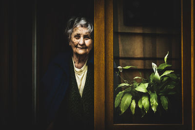 Portrait of smiling woman at home