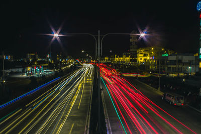 High angle view of light trails on city street at night