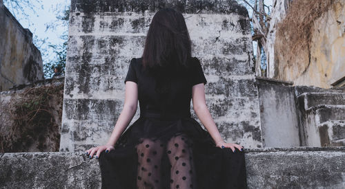 Rear view of woman sitting with horror style for halloween