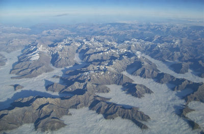 High angle view of snowcapped mountains against sky