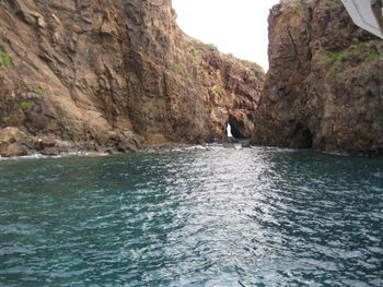 Scenic view of sea by cliff