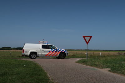 Car on road against clear sky