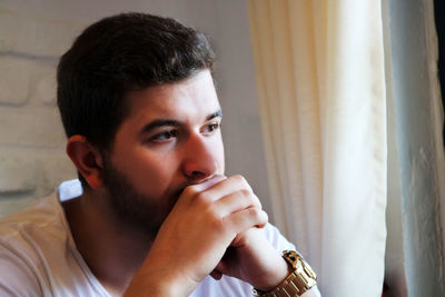 Portrait of young man looking away