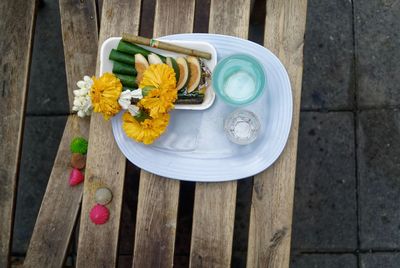 High angle view of religious offerings on table