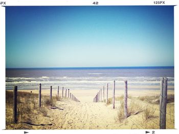 Scenic view of beach against clear sky