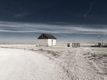 Lifeguard hut on beach against sky