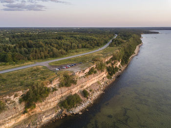 High angle view of road by sea against sky. a cliff with a sunset view in estonia.