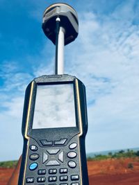 Low angle view of equipment against sky