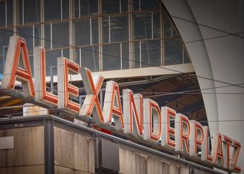 Low angle view of alexanderplatz text at entrance of building