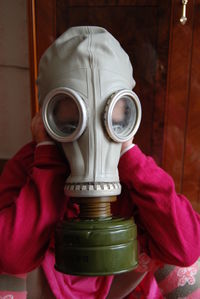 Close-up of person wearing gas mask