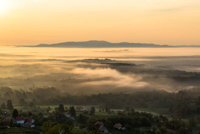 Scenic view of landscape against sky during sunset