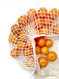 Close-up of orange fruits in basket